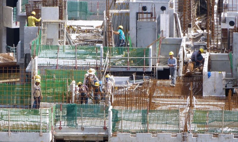 DVO Blog 2 ( Mobile ) Construction workers at a build site, representing cost volatility tracked in Navatar