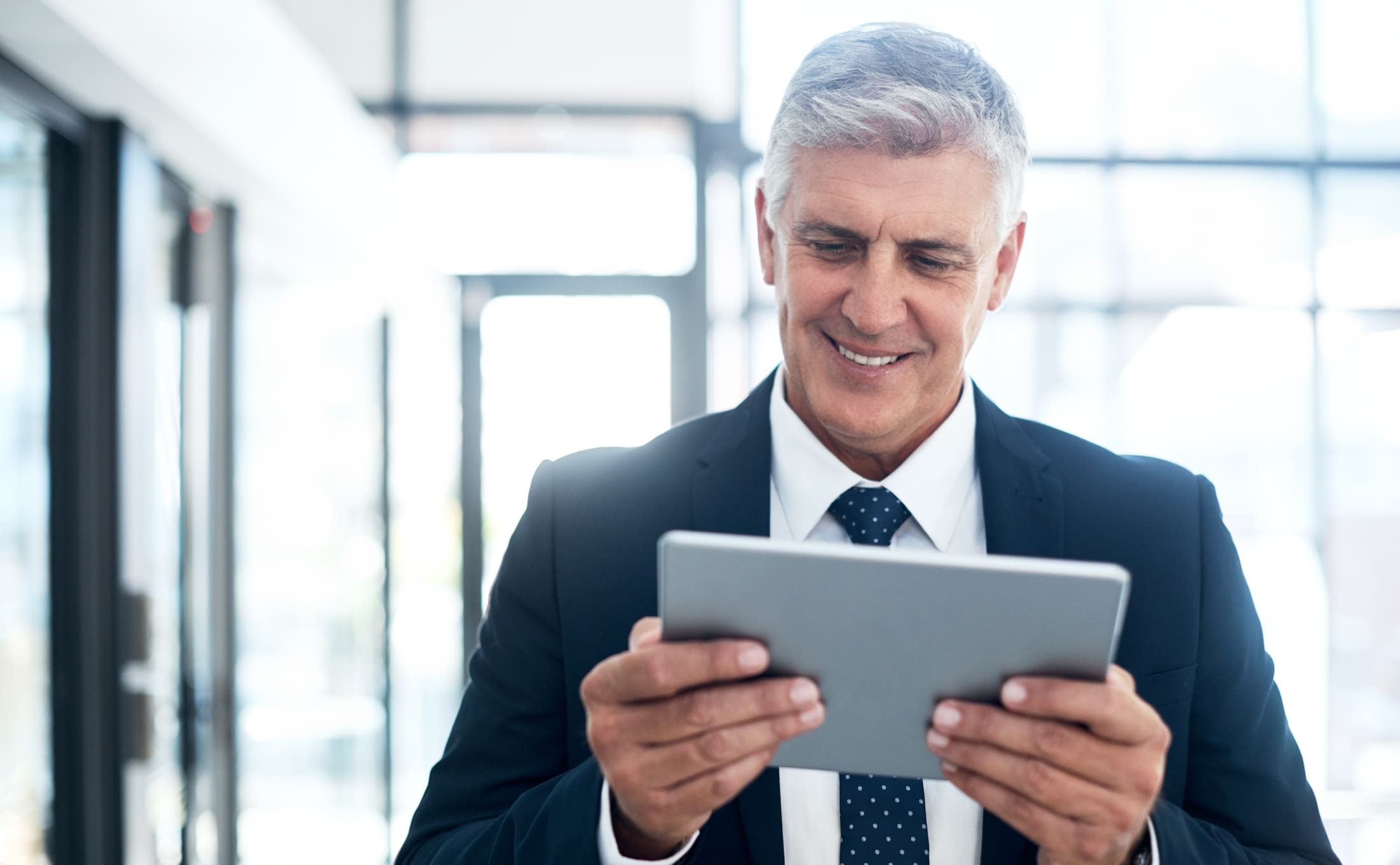 Businessman using a digital tablet in an office